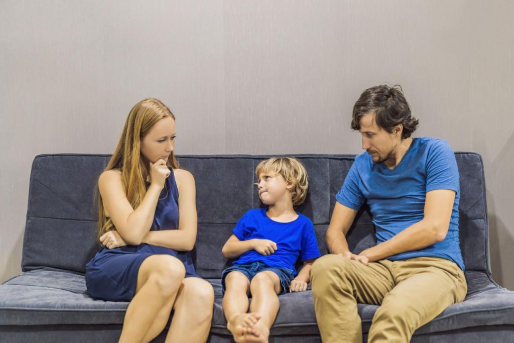 The Moment Your Child Realizes You Disagree. A couple disagreeing with a child,