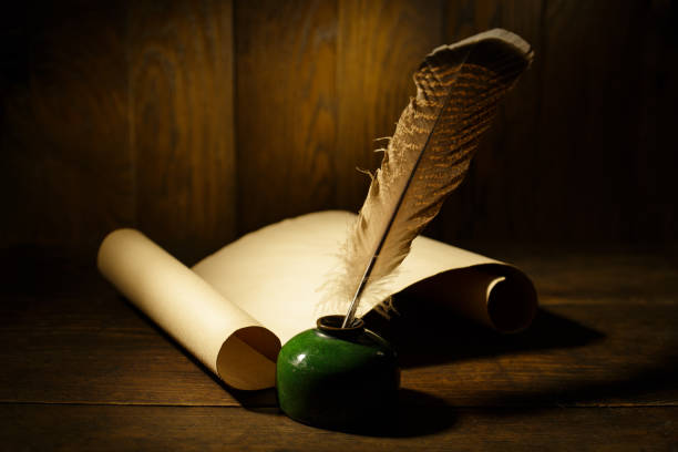 Contact form. Old quill and paper on wooden table.