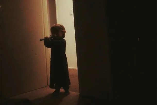A toddler enters a dark room after waking up to parents arguing.